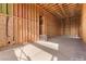 Unfinished RV garage with exposed wood framing, concrete flooring, and utility access at 5855 St Ebbes Ct, Las Vegas, NV 89131