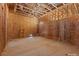 A spacious unfinished storage area shows exposed wood framing with electrical outlets ready for build out at 5855 St Ebbes Ct, Las Vegas, NV 89131