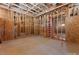 Unfinished storage area with exposed wood framing, ductwork, and concrete floor at 5855 St Ebbes Ct, Las Vegas, NV 89131