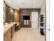 Bathroom with modern wooden cabinetry and a large mirror, and a walk-in shower at 6194 Stone Rise St, Las Vegas, NV 89135