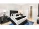 Modern bedroom with a plush bed and decor, next to the bathroom at 6194 Stone Rise St, Las Vegas, NV 89135