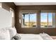 Bright bedroom featuring a comfortable bed and windows with city views at 6194 Stone Rise St, Las Vegas, NV 89135