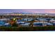 Panoramic city views at twilight from a home featuring neighborhood rooftops and distant mountains at 6194 Stone Rise St, Las Vegas, NV 89135