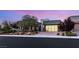 Contemporary home boasts a glass garage door, stone accents, and a meticulously landscaped front yard at 6194 Stone Rise St, Las Vegas, NV 89135