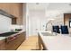 Well-appointed kitchen offers stainless steel appliances, wood cabinets and hardwood floors at 6194 Stone Rise St, Las Vegas, NV 89135