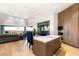 Open kitchen featuring a center island, dining table and access to the outdoor living area at 6194 Stone Rise St, Las Vegas, NV 89135