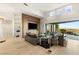 Spacious living room with a large entertainment center and access to outdoor patio at 6194 Stone Rise St, Las Vegas, NV 89135
