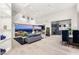 Bright, open living room with high ceilings, recessed lighting, and expansive views from sliding glass doors at 6194 Stone Rise St, Las Vegas, NV 89135