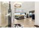 Bright, expansive living room featuring floor to ceiling windows and modern furnishings at 6194 Stone Rise St, Las Vegas, NV 89135