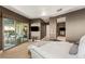 Large primary bedroom featuring wood floors and sliding glass doors that lead to the backyard at 6194 Stone Rise St, Las Vegas, NV 89135