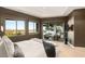 Bright primary bedroom with wood floors and a sliding glass door to the backyard at 6194 Stone Rise St, Las Vegas, NV 89135