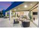 Inviting outdoor living space with modern seating, covered patio, and seamless indoor-outdoor flow at 6194 Stone Rise St, Las Vegas, NV 89135