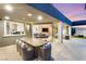 Expansive covered patio features ample seating and seamless access to the indoors and a gorgeous backyard at 6194 Stone Rise St, Las Vegas, NV 89135