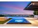 Sparkling spa and pool with an outdoor kitchen, covered patio, and beautiful city views at 6194 Stone Rise St, Las Vegas, NV 89135
