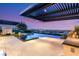 Inviting in-ground pool and spa, outdoor kitchen, covered patio, and stunning city views at 6194 Stone Rise St, Las Vegas, NV 89135