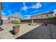Beautiful backyard with mature landscaping, a fountain, and privacy wall at 6205 Windy Oaks Ct, Las Vegas, NV 89139