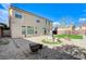 An entertainer's backyard featuring pavers, artificial turf, and a relaxing fountain at 6205 Windy Oaks Ct, Las Vegas, NV 89139