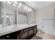 Bright bathroom with double sinks, large mirror, and tile flooring at 6205 Windy Oaks Ct, Las Vegas, NV 89139