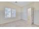 Light, airy bedroom with a window and a doorway leading to a closet at 6205 Windy Oaks Ct, Las Vegas, NV 89139