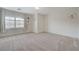 Neutral bedroom featuring carpet floors, bright walls and a large window at 6205 Windy Oaks Ct, Las Vegas, NV 89139