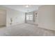 Neutral bedroom featuring carpet floors, bright walls and a large window at 6205 Windy Oaks Ct, Las Vegas, NV 89139