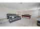 Comfortable bonus room featuring a large billiards table, media console, and plush seating at 6205 Windy Oaks Ct, Las Vegas, NV 89139