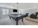 Upstairs bonus room with a billiards table, theater seating, and contemporary lighting at 6205 Windy Oaks Ct, Las Vegas, NV 89139