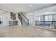 Inviting entryway with tile floors, staircase, and wrought iron railing at 6205 Windy Oaks Ct, Las Vegas, NV 89139