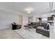Open concept design seamlessly connects the living room to the kitchen at 6205 Windy Oaks Ct, Las Vegas, NV 89139