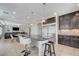 Bright open floorplan shows stainless steel fridge, granite countertops and a large center island at 6205 Windy Oaks Ct, Las Vegas, NV 89139