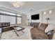 Living room featuring modern lighting, large windows, and comfortable seating at 6205 Windy Oaks Ct, Las Vegas, NV 89139