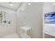 Modern shower with light stone wall and built in shelving at 6205 Windy Oaks Ct, Las Vegas, NV 89139