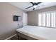 Minimalist bedroom with a comfortable mattress, natural light, and neutral tones at 6251 Tuckaway Cove Ave, Las Vegas, NV 89139