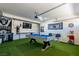 Spacious game room with pool table, Raiders decor, and fun amenities, perfect for entertaining at 6251 Tuckaway Cove Ave, Las Vegas, NV 89139