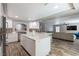 Bright kitchen features a large island, stainless steel appliances, and stylish backsplash at 6251 Tuckaway Cove Ave, Las Vegas, NV 89139