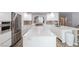 Spacious kitchen with white countertops, stainless steel appliances, and tile backsplash at 6251 Tuckaway Cove Ave, Las Vegas, NV 89139