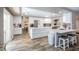 Modern kitchen with stainless steel appliances, white cabinets and granite countertops at 6251 Tuckaway Cove Ave, Las Vegas, NV 89139