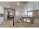 Open loft area with chandelier lighting, access to other bedrooms, and neutral carpet at 6251 Tuckaway Cove Ave, Las Vegas, NV 89139