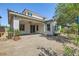 The backyard features gravel, pavers, privacy wall and covered porch at 632 Cadence Vista Dr, Henderson, NV 89011