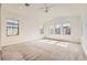 Bright bedroom featuring a ceiling fan and lots of natural light from multiple windows at 632 Cadence Vista Dr, Henderson, NV 89011