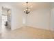 Bright dining room featuring neutral tile flooring and a view into the kitchen at 632 Cadence Vista Dr, Henderson, NV 89011