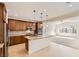 Modern kitchen with granite countertops, stainless steel appliances, and open floor plan at 632 Cadence Vista Dr, Henderson, NV 89011