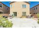 Private backyard with a concrete patio, BBQ grill, and desert landscaping, perfect for outdoor gatherings at 6409 Dundock Ave, Las Vegas, NV 89122