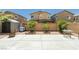 The backyard features a concrete patio, storage shed, and desert landscaping offering low maintenance and privacy at 6409 Dundock Ave, Las Vegas, NV 89122