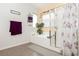 Bathroom featuring a soaking tub and floral shower curtain at 6409 Dundock Ave, Las Vegas, NV 89122