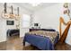 Bright bedroom with hardwood floors, guitars on the wall, and a harp at 6409 Dundock Ave, Las Vegas, NV 89122