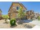 Attractive two-story home with low-maintenance front yard and attached two-car garage in a residential neighborhood at 6409 Dundock Ave, Las Vegas, NV 89122