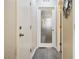 Hallway featuring a frosted glass door leading to the laundry room at 6409 Dundock Ave, Las Vegas, NV 89122