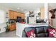 Functional kitchen featuring stainless steel appliances, granite countertops, and ample storage space with tile flooring at 6409 Dundock Ave, Las Vegas, NV 89122