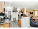 Modern kitchen features granite countertops, gas stove, and stainless steel appliances with convenient pantry at 6409 Dundock Ave, Las Vegas, NV 89122